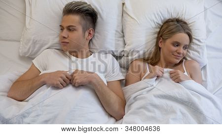 Man And Woman Lying Bed, Smiling Happily After First Sex Experience, Lovemaking