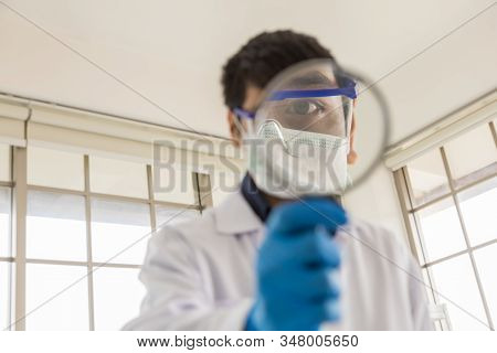 Health Care Concept. Close Up Of Young Asian Docter With Medical Particulate Protective Mask Holding