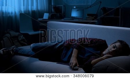 Young Male Watching Night Show On Tv, Awkward Age, Difficulties With Parents