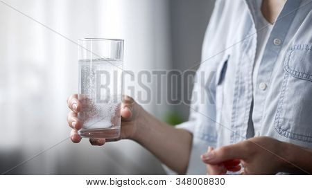 Woman Taking Painkillers, Throwing Aspiring Into Water Glass, Medication