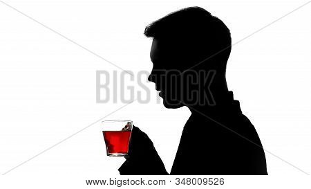 Male Shadow Enjoying Aroma Of Freshly Brewed Tea, Rest After Work Day, Quality