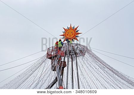 Moscow, Russia - February 27, 2019: Workers Decorate Manezhnaya Square With Electric Garlands For Ru