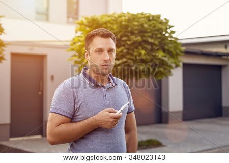 Electronic Cigarettes, Cigarette Technology. Tobacco Iqos System. Close-up Of A Man Smoking An Elect