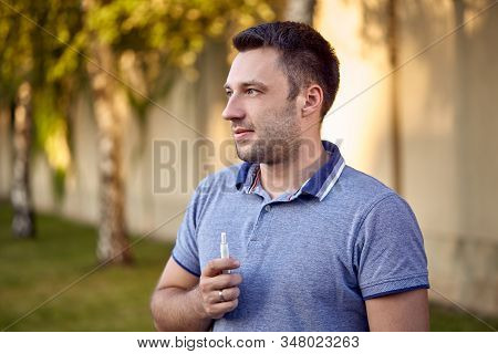 Electronic Cigarettes, Cigarette Technology. Tobacco Iqos System. Close-up Of A Man Smoking An Elect