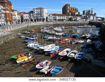 Multi-colored Boats In The Port Of Castro Urdiales At Low Tide, Spain