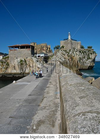 People Walking At The Port In Castro Urdiales, Spain