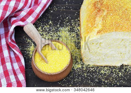 Top View Of Cornmeal In Wooden Bowl