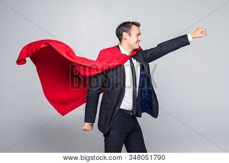 Young Handsome Businessman In Suit And Hero Cout With Streight Hand Isolated On White Background