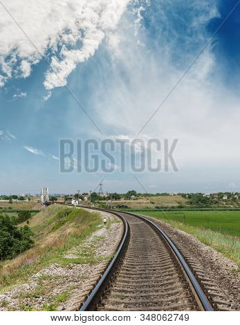 rail road to horizon in bridge and blue sky with clouds