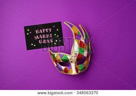 Festive, Colorful Mardi Gras Or Carnivale Mask And Greeting Card Over Purple Background. Party Invit