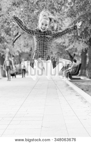 Tireless And Energetic Activity. Small Child Jumping In Casual Fit For Physical Activity. Active Chi