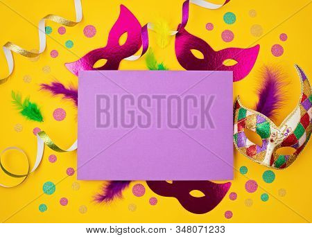 Festive, Colorful Mardi Gras Or Carnivale Mask And Accessories Over Yellow Background. Party Invitat