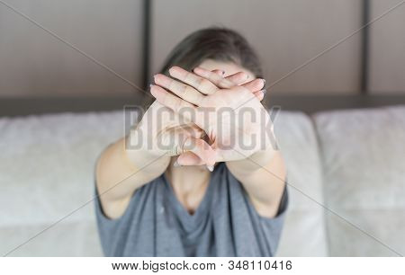 Beautiful Brunette Woman Hides Her Face From The Camera.