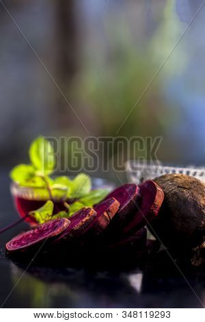 Beetroot Face Mask On The Black Glossy Surface Consisting Of Some Grated Beetroot Vegetable And Sour