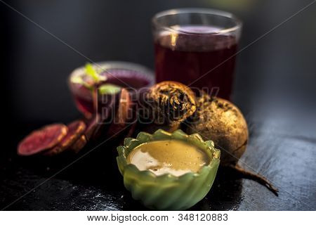 Close Up Of Fresh Beetroot Juice In A Glass Along With Some Multani Mitti Or Fuller's Earth In Glass