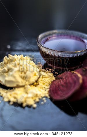 Face Mask For A Natural Glow For All Skin Types On The Black Wooden Surface Consisting Of Some Beetr