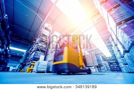 Forklift Loader In Storage Warehouse Ship Yard. Distribution Products.