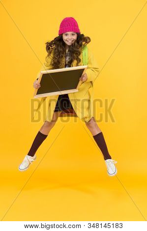 Free After School. Stylish Schoolgirl Blackboard. Copy Space For Ad. Happy Pupil Kid Jumping. Back T