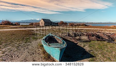 Historic Fishing Village And The Etang De Canet Lagoon And Canigou In The Background