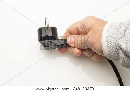 Black Plug On Colored Background
