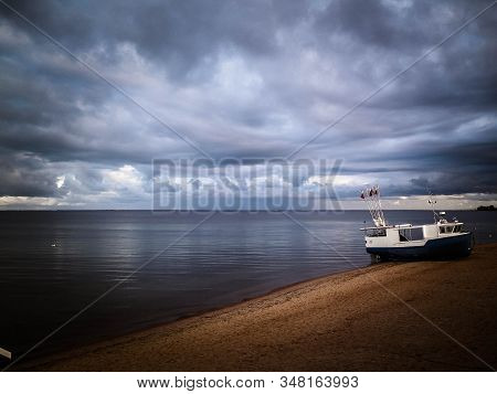Fishing Boat On Baltic Sea Coast. Stormy Weather. Mechelinki, Poland, Pucka Bay.