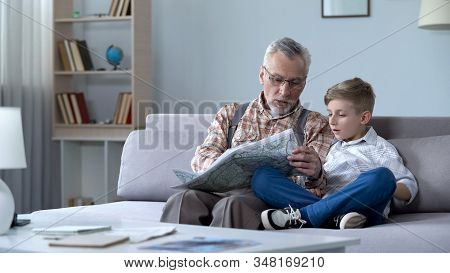 Grandfather Veteran Viewing Map With Grandson Showing Front Line Remembering War