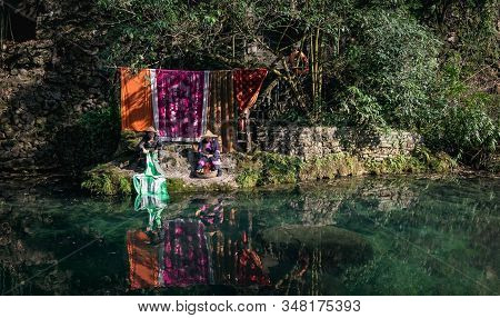 Yichang, Hubei / China - Dec 25 2019:  Native Chinese Woman Are Washing The Cloth At The Stream In L