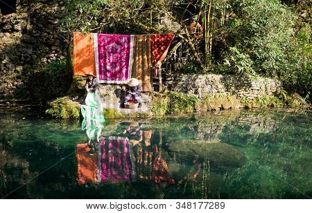Yichang, Hubei / China - Dec 25 2019:  Native Chinese Woman Are Washing The Cloth At The Stream In L