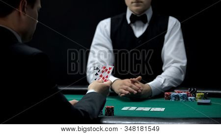 Upset Businessman Having Bad Cards Combination In Poker, Weak Hand Casino Wins