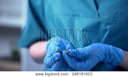 Therapist Holding Pill With Falsified Medication, Pharmaceutical Business