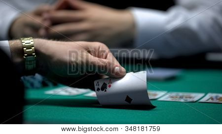 Unfortunate Poker Game, Hand Of Casino Player Checking Bad Card Combination