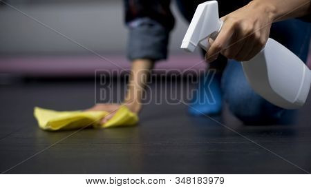 Close-up Of Female Mopping Floor In The Living Room, Sterilizing The Household