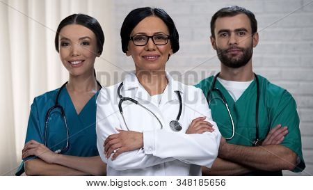 Medical Staff Smiling At Camera, Health Care System And Insurance Reform Policy