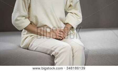 Woman Suffering From Strong Menstrual, Gynecological And Urological Problems