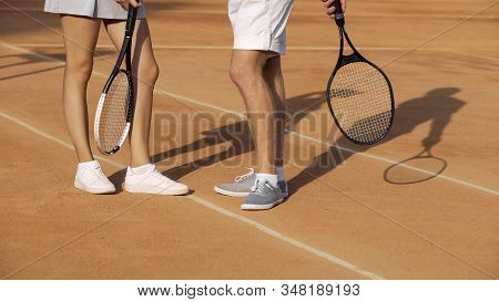 Man And Woman Standing On Court And Talking About Last Tennis Match, Hobby