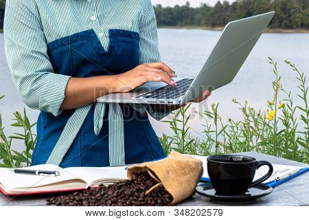 The Woman Inspected The Coffee Bean Quality And Recorded The Results.