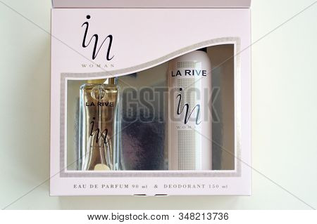 La Rive In Woman Deodorant And Perfume Bottles In Brand Box On Beige Background. La Rive S.a. Is One