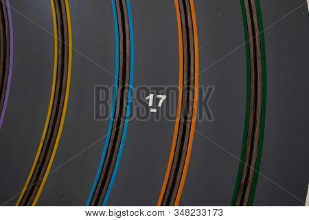 Number 17, Seventeen, Yellow And Blue Paint On Grey Background.