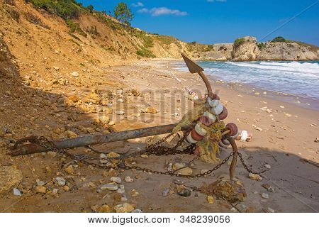 An old ship's anchor on the beach on the Black Sea coast at Kilimli Bay, near Agva, Sile, in north west Turkey