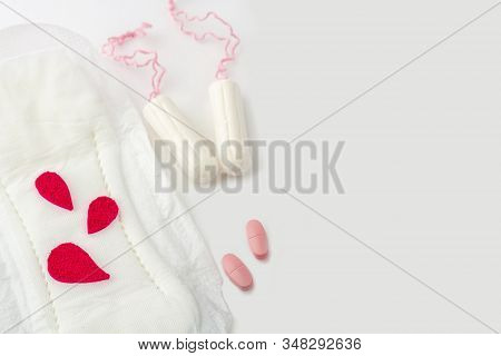 Protective Menstrual Pad With Fabric Blood Drops, Cotton Tampons, Pain Pills On White Background. Th