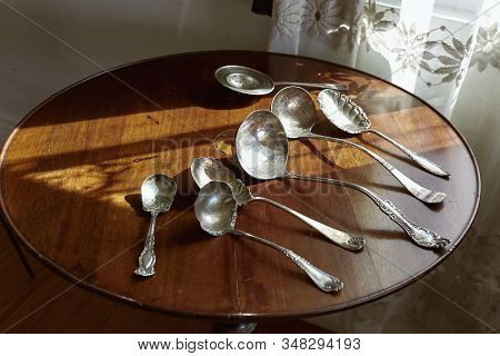 Vintage Silverware On A Wooden Table For Sale At An Antique Shop. Maine, Usa