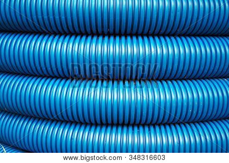 Blue Curvilinear Tubes For Industry In City.
