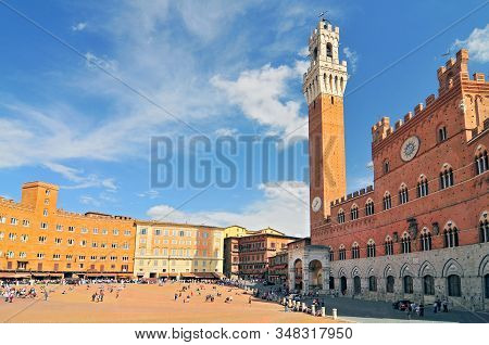 The Torre Del Mangia And The Palazzo Publico In The Campo, Siena, Tuscany, Italy.