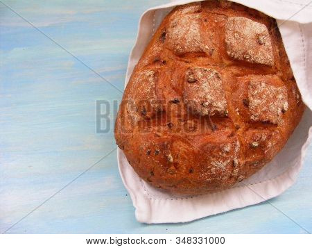 Bread On A White Napkin On Vintage Blue Wooden Background