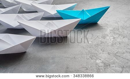 Business Concept, Paper Boat, The Key Opinion Leader, The Concept Of Influence. One Blue Paper Boat 