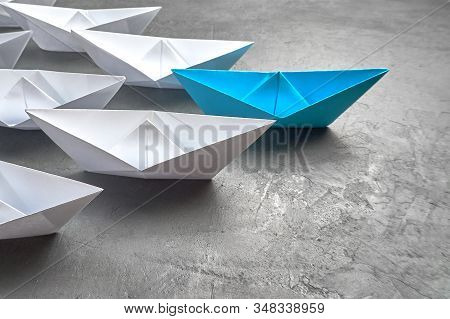 Business Concept, Paper Boat, The Key Opinion Leader, The Concept Of Influence. One Blue Paper Boat 