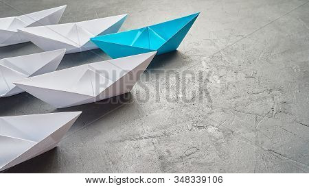 Business Concept, Paper Boat, The Key Opinion Leader, The Concept Of Influence. One Blue Paper Boat 