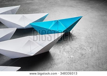 Business Concept, Paper Boat, The Key Opinion Leader, The Concept Of Influence. One Blue Paper Boat 
