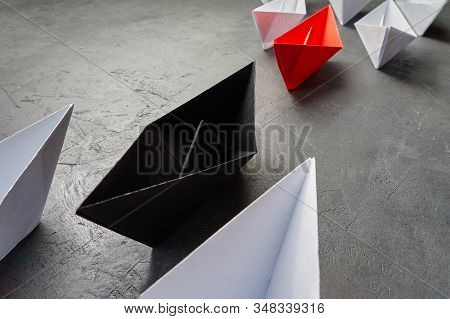 Opportunities Business Key Opinion Leader, Influence Concept. One Black Paper Boat As A Leader, Lead