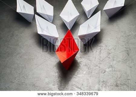 Business Concept, Paper Boat, The Key Opinion Leader, The Concept Of Influence. One Red Paper Boat A